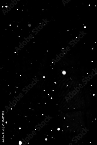 Canvastavla Bright snow particles falling on black background, winter compositing layer