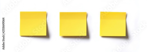 Three yellow sticky notes with slightly curled tops casting soft shadows on a clean white background, conveying simple organization and calm anticipation
