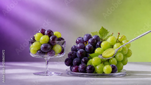 Fresh Shine Muscat and Purple Grapes with Sliced Fruit on Colorful Background