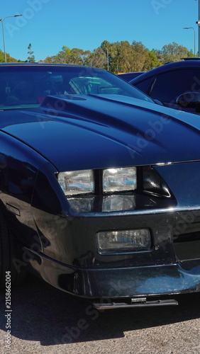 Classic Sports Car Front With Hood Scoop And Headlights