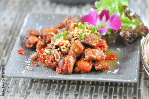 stir fried pork or deep fried pork , stir fried pork with garlic and chili
