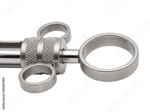 Dental syringe metal aspirating instrument close up for medical anesthesia procedure isolated on black background professional steel clinical healthcare tool equipment for dentistry practices.