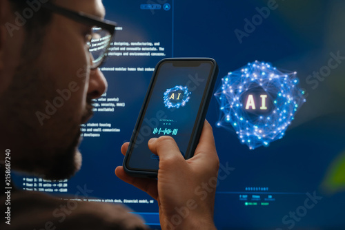 Rear view close-up of man holding smartphone and talking with AI voice assistant app with futuristic artificial intelligence chatbot or AI agent interface in the background. Space for text 