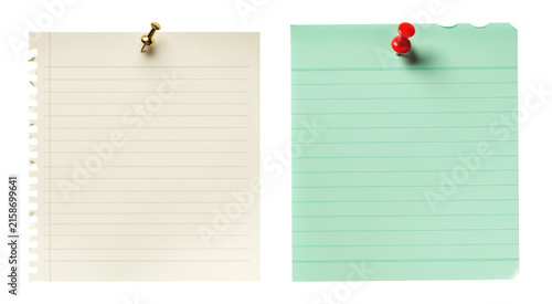 Blank lined stationery paper pages pinned with thumbtacks on black background for school homework reminders office task lists family chore planning organization text notice memo board