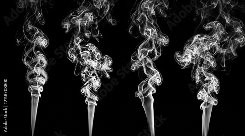 Four white smoke columns rising on black background, swirling upward into intricate curling vapor patterns, minimalist abstract display of motion, texture, and delicate fluid shapes.