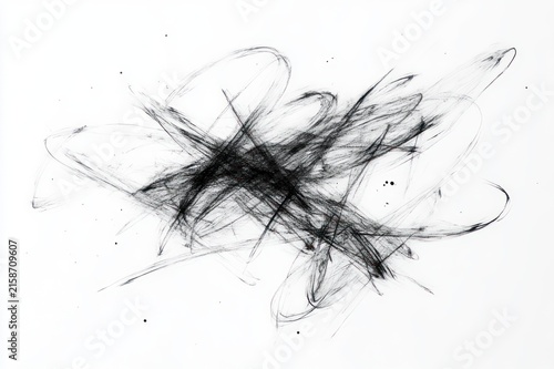 turbulent charcoal scribbles and smudged black strokes with scattered ink splatters on white paper conveying energetic restless motion