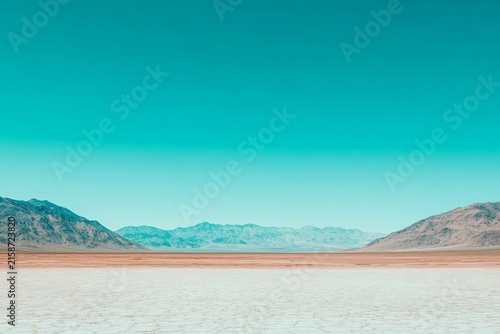selective focus close up of distant mirage in arid desert environment