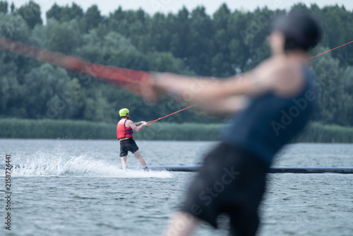Wakeboarder Riding Through Water with Dynamic Splash