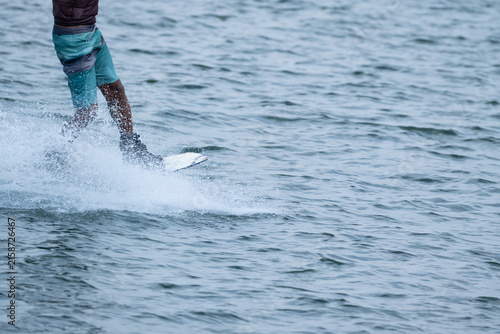 Wakeboarder Riding Through Water with Dynamic Splash