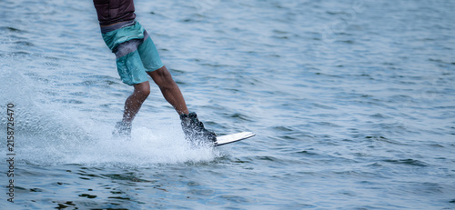 Wake boarder Riding Through Water with Dynamic Splash