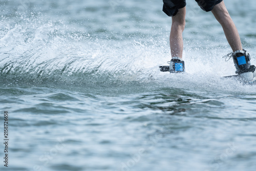Wakeboarder Riding Through Water with Dynamic Splash