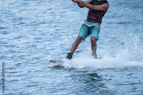 Wakeboarder Riding Through Water with Dynamic Splash