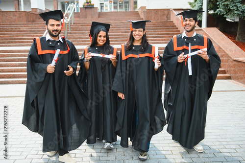 Fotografía Indian graduating students celebrating academic achievement with diplomas