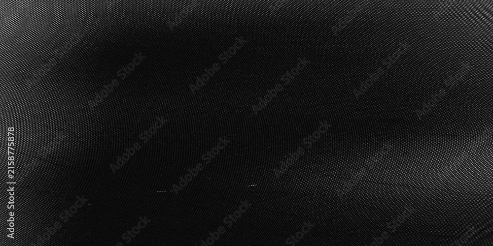 Фотография Abstract dark fabric texture with subtle circular patterns and minimal light gra