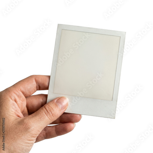 Konstfotografi A hand holding a blank white square photo frame isolated