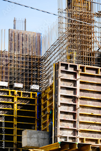 Concrete formwork and steel reinforcement structure at active construction site showing modern building methods and engineering construction processes