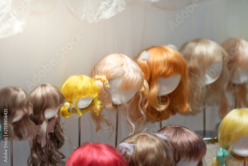 Fototapeta kuchenna Colorful handmade doll wigs display in various styles
