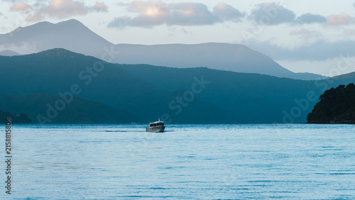 Last light as a small fast boat makes it's way towards port.