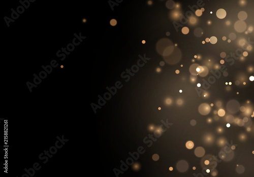 Warm gold dust glows with scattered sparkling particles. Luminous bokeh creates elegant festive depth and a luxurious visual texture. Ideal for holiday designs.