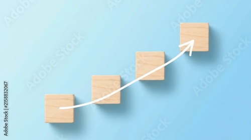 Wooden blocks arranged as steps with an upward arrow