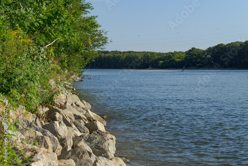 View to the river from the river bank in the rural countryside