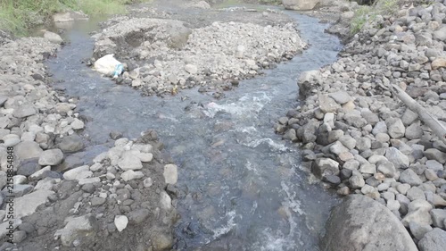 Camera Moving Forward Along a Rocky Stream
