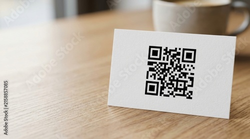 Business Card with QR Code on Wooden Desk Near Coffee Mug for Marketing