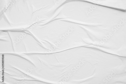 white crumpled and creased glued wrinkled paper poster texture background