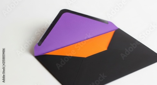 A black envelope with a purple and orange insert illustration