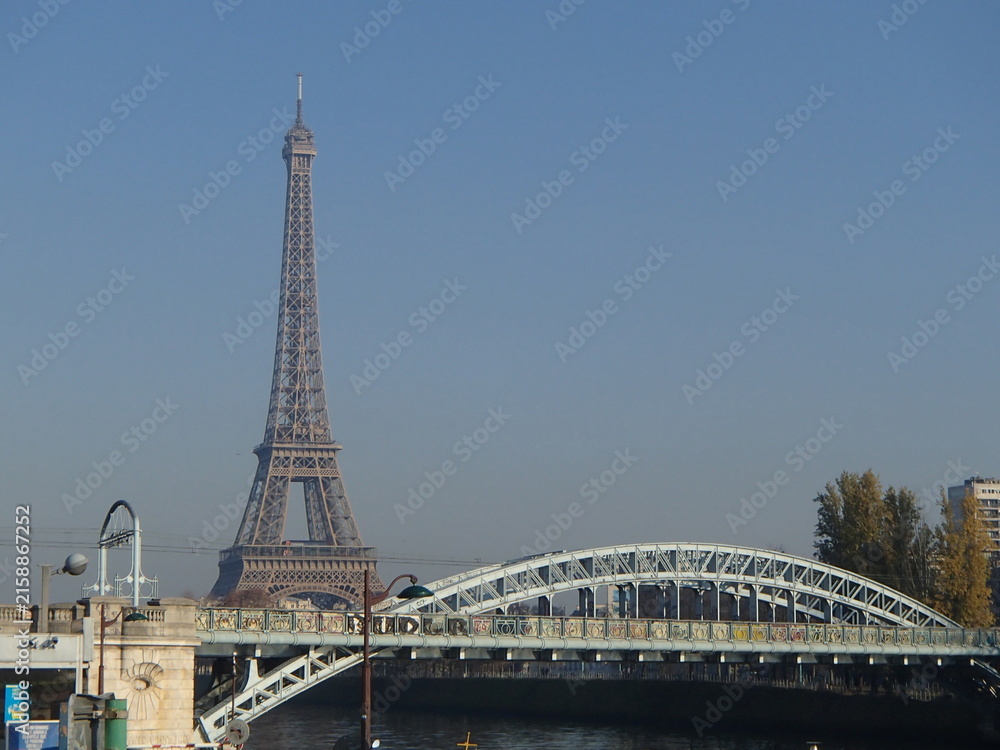 Fototapeta premium Eiffel Tower and Pont d'Iena bridge over the Seine River in Paris