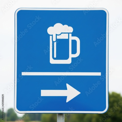 Directional Sign To A Refreshing Beverage Establishment Low Angle View
