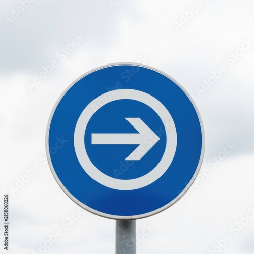 Directional Blue Sign Indicating Forward Movement