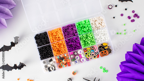 A set of multicolored beads for making handmade Halloween bracelets. 