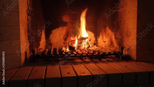 View of fire in home fireplace in complete darkness
