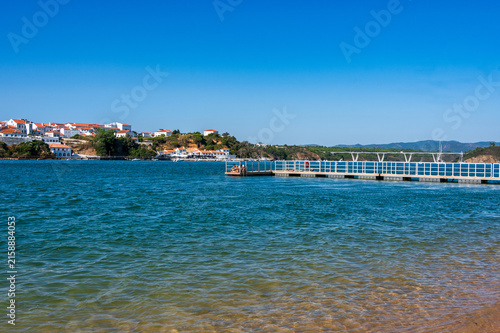 Photography Wooden pier over the Mira River estuary at Vila Nova de Milfontes, Portugal
