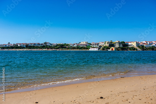 Sandy beach and river view of Vila Nova de Milfontes town, Portugal