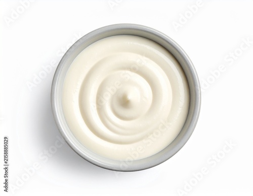 Top view of low-fat cream substitute in bowl on white background