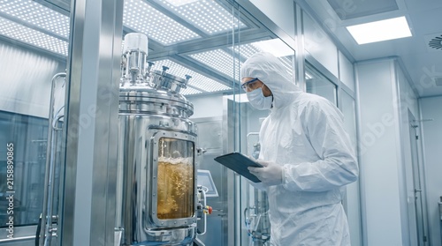 Laboratory Technician in Clean Room Monitoring Fermentation Process in High-Tech Facility