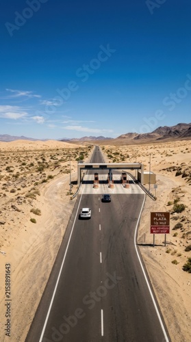 Desert Highway Toll Booth Approach Under Bright Blue Sky