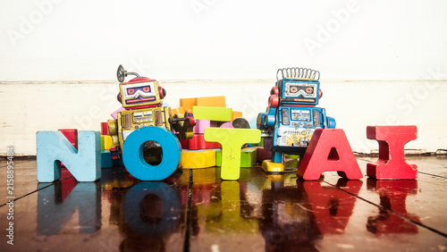 NOT AI with wooden letters and retro robots 