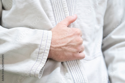 Bild auf Leinwand White kimono traditional martial art background, copy space, jiujitsu, todo, cas