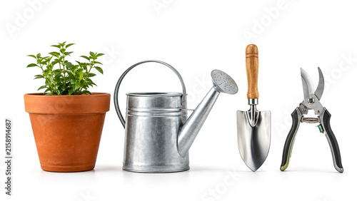 Set of gardening tools including potted plant watering can trowel and secateurs isolated on white background.