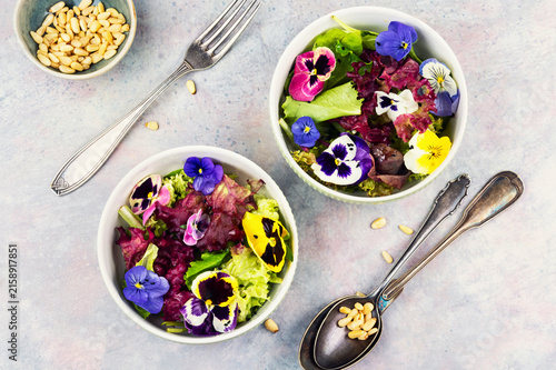 Healthy floral salad with mixed greens and edible blossoms.