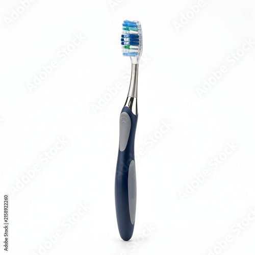 Modern manual toothbrush with blue and grey handle isolated on white background.