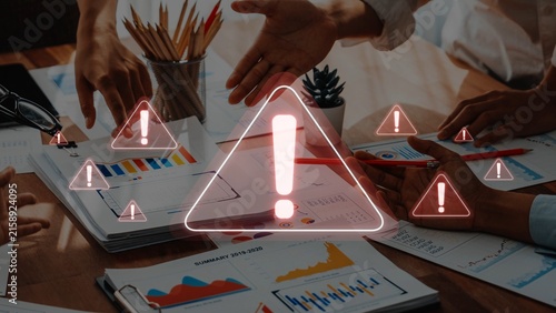 Cuadro en lienzo A diverse team collaborates over important project documentation in a modern office, emphasizing urgent decision-making with visual warnings and data insights