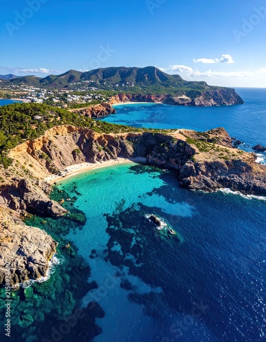 Vibrant Turquoise Coastal Cove with Rugged Cliffs and Blue Sea