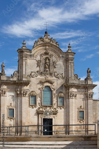 Historic Baroque Church Facade With Ornate Stone Sculpture Under Blue Sky