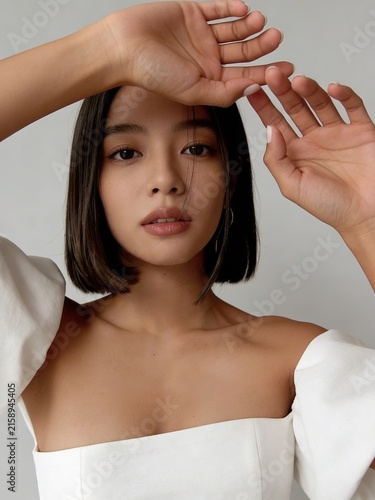 Graceful lady showcasing serenity. Stylish female model exudes calm confidence and beauty