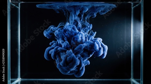Abstract blue acrylic ink cloud dissolving in water isolated on black background