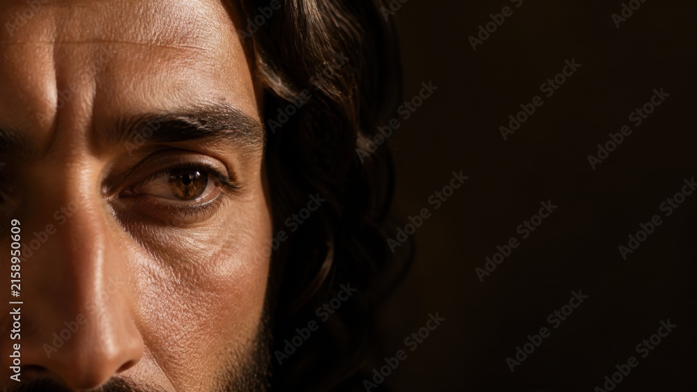 Fototapeta premium Close up portrait of Jesus Christ with thoughtful gaze. Biblical faith, compassion, healing, and spiritual leadership concept with dark copy space